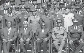  ??  ?? President Mugabe poses for a picture at the National Defence College yesterday flanked by (from left to right) Vice President Emmerson Mnangagwa, Defence Minister Dr Sydney Sekeramayi, National Defence College Commandant Air Vice Marshal Michael...