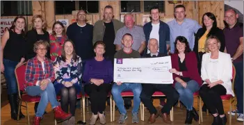  ??  ?? Cullina NS Principal Leona Twiss and staff receive a cheque for €4,000 for the school’s Autism Unit from the committee of Small Mike’s All-Ireland at a presentati­on in Kate Kearney’s on Friday night