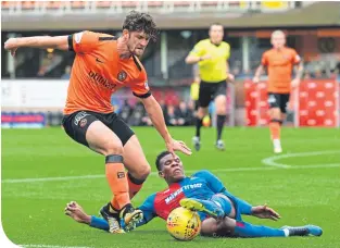  ??  ?? Dundee United’s Stewart Murdoch is stopped in his tracks by the Caley Jags’ Riccardo Calder.