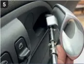  ??  ?? Pull the interior door handle as if you're opening the door. Remove the Torx screw holding the handle in place and slide the handle straight off the lever.