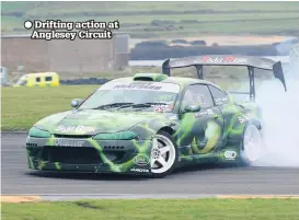  ??  ?? Drifting action at Anglesey Circuit