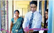  ??  ?? Dr. Dayan Rajapakse, Group Managing Director, ESOFT METRO CAMPUS and Mrs. G.K.Y.N. Perera, Principal, Mahanama Navodya College, Panadura opening the new Computer Lab.