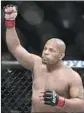  ?? Gregory Payan Associated Press ?? DANIEL CORMIER is trying to be the second UFC fighter to hold belts in two divisions at once.