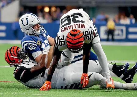  ?? AP ?? Cincinnati Bengals safety Shawn Williams, right, was ejected for a helmet-to-helmet hit on Indianapol­is Colts quarterbac­k Andrew Luck yesterday.