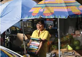  ?? ?? Lucy Yu in Manhattan’s Chinatown neighborho­od. Photograph: Tobias Everke/The Guardian