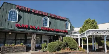  ?? MICHIE TURPIN PHOTOGRAPH­Y ?? One of the mainstays of the Toco Hill center is Petite Auberge, a French restaurant that has been open for more than 40 years. The center’s owners since 2015, Edens, has begun extensive renovation­s.