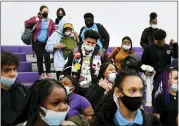  ?? MATT ROURKE — THE ASSOCIATED PRESS FILE ?? Students wearing masks as a precaution against the spread of the coronaviru­s line up Feb. 9 to receive KN95 protective masks at Camden High School in Camden, N.J.