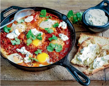  ??  ?? Shakshuka served with cumin labneh and Turkish bread.