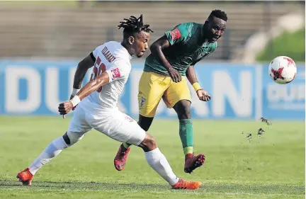  ?? / ANESH DEBIKY/GALLO IMAGES ?? Golden Arrows defender Zolani Nkombelo clears the ball from Free State Stars’ Nhlanhla Vilakazi. Nkombelo has been a solid performer in his debut season.