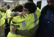  ?? CARLOS GIUSTI — THE ASSOCIATED PRESS ?? Rescue team members Candida Lozada, left, and Stephanie Rivera, right, embrace as they wait to assist in the aftermath of Hurricane Maria in Humacao, Puerto Rico, Wednesday.