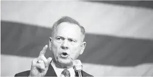  ?? BRYNN ANDERSON/AP ?? A new document shows that an effort to influence the 2017 Senate election Russian disinforma­tion teams. Republican Roy Moore narrowly lost.