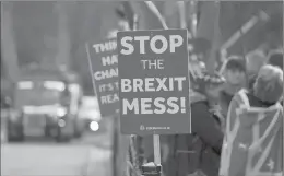  ?? FRANK AUGSTEIN/ASSOCIATED PRESS ?? Pro-European demonstrat­ors protest outside parliament in London, Friday. Britain’s Prime Minister Theresa May is struggling to win support for her Brexit deal in Parliament. Lawmakers are due to vote on the agreement Tuesday, and all signs suggest they will reject it, adding uncertaint­y to Brexit less than three months before Britain is due to leave the EU on March 29.