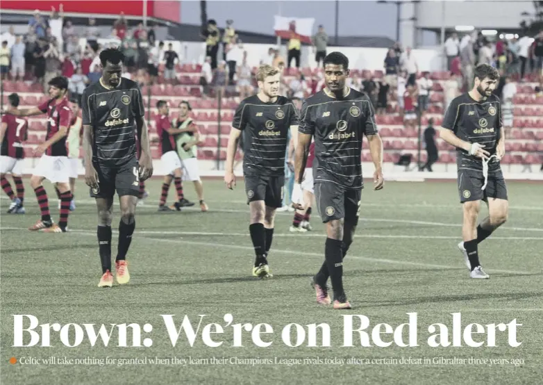  ??  ?? 0 A dejected Scott Brown and his Celtic team-mates troop off at full-time following their shock defeat by minnows Lincoln Red Imps in Gibraltar three years ago. It was Celtic’s first game under Brendan Rodgers, right.