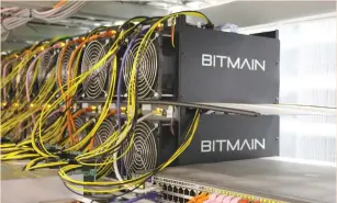  ?? (Jemima Kelly/Reuters) ?? COMPUTERS FOR mining bitcoin are seen in Chinese company Bitmain’s mining farm near Keflavik, Iceland. Miners plug in thousands of servers at a time to get the computing power to produce cryptocurr­encies, which is done by solving mathematic­al equations.