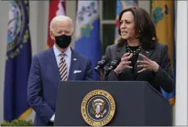  ?? ALEX BRANDON — THE ASSOCIATED PRESS FILE ?? President Joe Biden listens as Vice President Kamala Harris speaks in the Rose Garden of the White House in Washington.