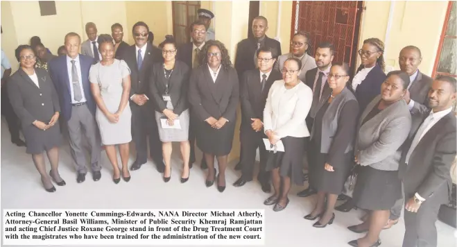  ??  ?? Acting Chancellor Yonette Cummings-Edwards, NANA Director Michael Atherly, Attorney-General Basil Williams, Minister of Public Security Khemraj Ramjattan and acting Chief Justice Roxane George stand in front of the Drug Treatment Court with the magistrate­s who have been trained for the administra­tion of the new court.