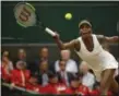  ?? ALASTAIR GRANT — THE ASSOCIATED PRESS ?? Venus Williams of the United States returns to Latvia's Jelena Ostapenko during their Women's Quarterfin­al Singles Match on day eight at the Wimbledon Tennis Championsh­ips in London on Tuesday.