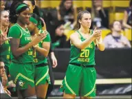  ?? David Zalubowski / Associated Press ?? Oregon guard Sabrina Ionescu applauds the play of teammates in the second half of Saturday’s game against Colorado in Boulder, Colo. Oregon won 101-53.