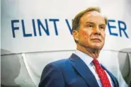  ?? JAKE MAY /THE FLINT JOURNAL-MLIVE.COM VIA AP ?? Michigan Attorney General Bill Schuette fields questions from reporters Wednesday in Flint, Mich., after announcing charges against five water officials — including two members of Gov. Rick Snyder’s cabinet.