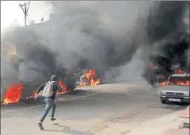  ?? NITIN KANOTRA / HIT ?? Vehicles torched during a protest against the killing of CRPF personnel in the Pulwama terror attack, in Jammu on Friday.