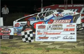  ?? SUBMITTED PHOTO - RICH KEPNER ?? Craig Von Dohren celebrates in victory lane with the $10,000winner’s check after winning the Forrest Rogers Memorial on August 13at Grandview.