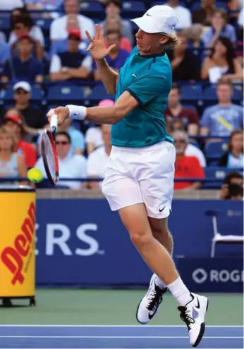  ?? VAUGHN RIDLEY/GETTY IMAGES ?? Denis Shapovalov connects on the way to a three-set victory, one of three Canadians to advance.