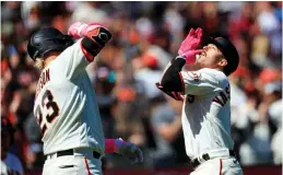  ?? Tribune News Service/bay Area News Group ?? San Francisco Giants’ Mike Yastrzemsk­i (5) celebrates with Joc Pederson (23) after hitting a solo home run in the sixth inning at Oracle Park in San Francisco, on Sunday.