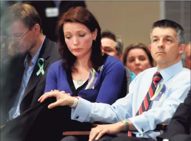  ?? Hearst Connecticu­t Media file photo ?? Nicole and Ian Hockley, parents of Sandy Hook victim Dylan Hockley, listen to the Bipartisan Task Force on Gun Violence Prevention and Children's Safety hearing at Newtown High School, Jan. 30, 2013.