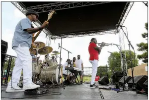  ?? Arkansas Democrat-Gazette/THOMAS METTHE ?? Rodney Block (right), onstage in Little Rock with his Rodney Block Collective last month, says that LL Cool J’s “Around the Way Girl” is his favorite summer jam.