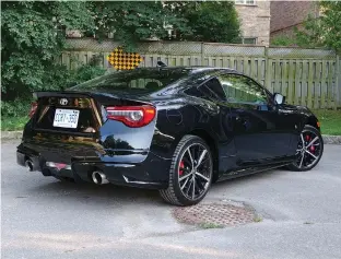  ??  ?? The Toyota 86 GT SE receives a flight of Toyota Racing Developmen­t (TRD) parts, including a dual exhaust that makes you feel like you’re sitting directly on the muffler when you start the engine.