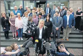  ??  ?? PAIN OF DECEIT: Det Chief Insp Marsh with victims outside court yesterday