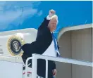  ?? (Leah Millis/Reuters) ?? US PRESIDENT Donald Trump boards Air Force One to travel to Singapore yesterday ahead of Tuesday’s summit with North Korea.