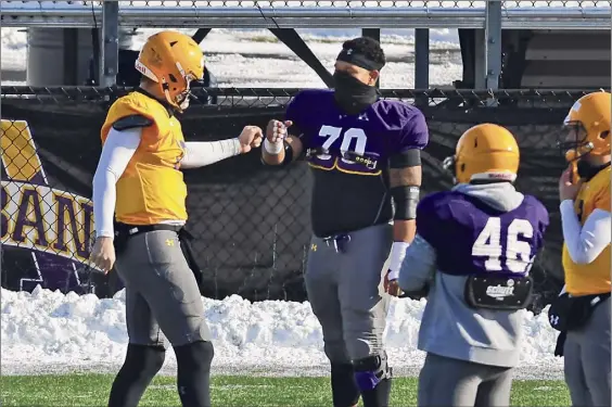  ?? Photos by Lori Van Buren / Times Union ?? Ualbany quarterbac­k Jeff Undercuffl­er, left, will rely on his offensive line, led by returning starter Kobe Thomas (70), to protect him and clear the way for running back Karl Mofor. Thomas, a redshirt sophomore, is moving from right guard to center, replacing the graduated Niko Culnan.