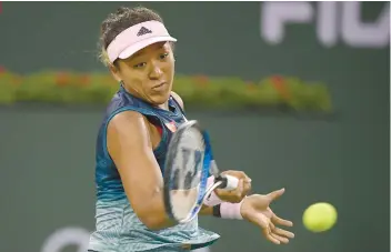  ?? AP FOTO ?? RETURN TO SENDER. No. 1 ranked Naomi Osaka returns a shot by Danielle Collins in their third round match of the BNP Paribas Open.