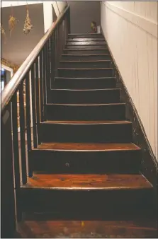  ??  ?? A view of the original stairs leading up to the second floor in the Taille de Noyer.