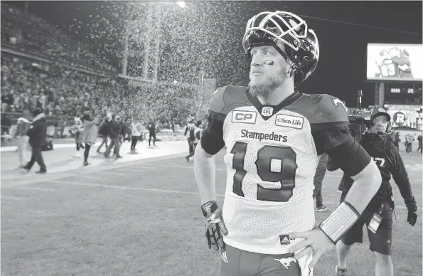  ?? PETER POWER/THE CANADIAN PRESS. ?? Calgary Stampeders quarterbac­k Bo Levi Mitchell walks off the field after a 39-33 overtime loss to the Ottawa Redblacks in the 2016 Grey Cup game.