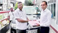  ?? ?? With the dissolutio­n of local councils, outgoing members who used state vehicles were asked to hand over them to the respective councils' admistrati­ve chief. Here the Yatiyantot­a PS chairman is seen handing over his vehicle. Pic by Ravindra Welagedara