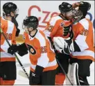  ?? ONDREJ DEML — CTK VIA AP ?? Flyers, from left, Tyler Pitlick, James van Riemsdyk, Jakub Voracek and Carter Hart, celebrate after they beat Chicago, 4-3, in an NHL Global Series game in Prague, Czech Republic, Friday.