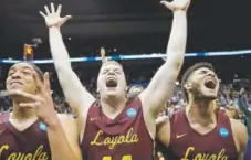  ?? David Goldman, The Associated Press ?? From left, Loyola Chicago’s Lucas Williamson, Nick Dinardi and Christian Negron celebrate.