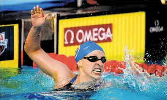  ?? Mark J. Terrill / Associated Press ?? Katie Ledecky can’t contain her excitement after breaking a 5-year-old world record.