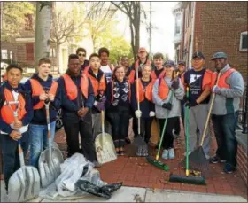  ?? EVAN BRANDT — DIGITAL FIRST MEDIA ?? A joint cleanup team of students from The Hill School and Pottstown High School tackled the leaves on King Street Friday for the Fourth Annual PottstownC­ARES Day.