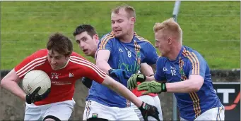  ??  ?? Cian Callan evades a couple of Wicklow tacklers.