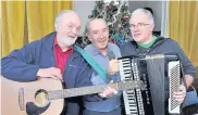  ??  ?? Music Customers were entertaine­d with Christmas songs by Alastair MacFarlane, Jim Ferguson and Kenny Finnie 151216camb­usl_02