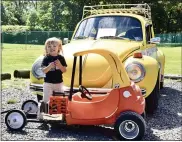  ??  ?? Hudson Gallagher, 2, with his modified Little Tikes Cozy Coupe in front of his family’s Bumble Bee, a 1973VW Super Beetle. The Gallaghers use their VW Bug for car shows and getting their Christmas trees home.