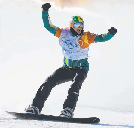  ?? Picture: AAP PHOTO ?? Jarryd Hughes celebrates after crossing the finish line and winning the silver medal in men's Snowboard Cross.