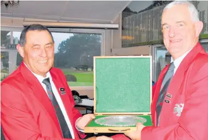  ?? ?? Manawatu¯ Eagles captain Stuart Atkins presents the trophy to president Danny Mickleson.