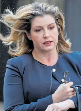  ?? Pictures: SIMON DAWSON, PETER NICHOLLS/REUTERS, GETTY ?? Penny Mordaunt has remained tight-lipped over her Cabinet future