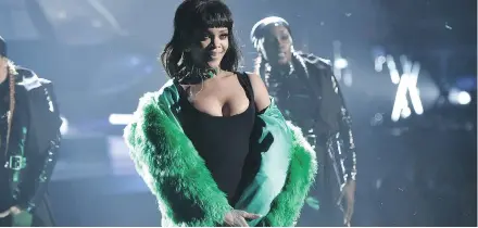  ?? PHOTOS: JOHN SHEARER/ THE ASSOCIATED PRESS ?? Rihanna is among the A- list musicians who are co- owners of the music streaming service called Tidal.