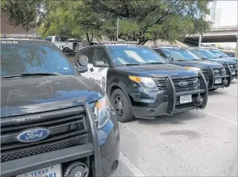  ?? Jay Janner Associated Press ?? THE POLICE DEPARTMENT in Austin, Texas, said it pulled nearly 400 Ford Explorers from its f leet after finding that 20 officers had elevated levels of carbon monoxide, including one who briefly blacked out.
