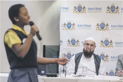  ?? Picture: Yeshiel Panchia ?? FOOD FOR THOUGHT. Gauteng MEC for roads and transport Ismail Vadi listens to a poetry reading by Grade 7 pupil Tinyiso Baloyi at the Transport Career Day for High Schools in Tshwane yesterday.